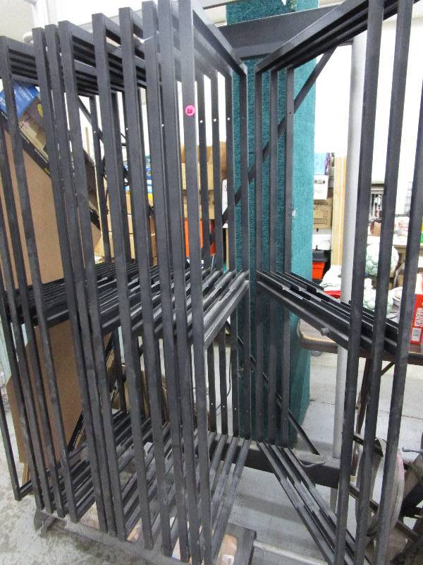 lot 20 image: Poster Display Metal Stand but he displayed Shingles on it