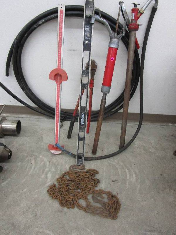 lot 66 image: Level, Belt Measurer, Pipe, Barrel Pumps & Snow Rake for Cars, Telescope, 34 Poly Tubing