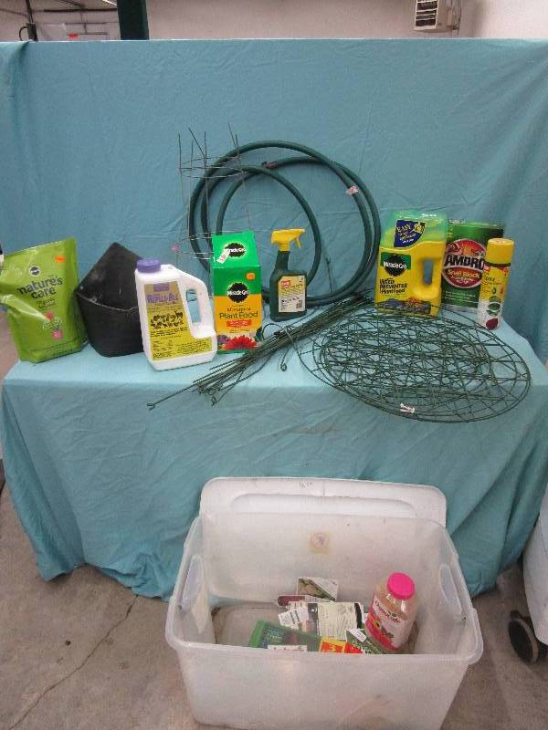 lot 184 image: Tub full of Garden Supplies, Hose, Peony Cages and More