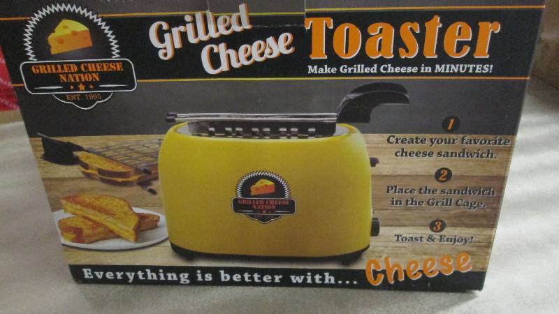 lot 22 image: Grilled Cheese Toaster open box, un...
