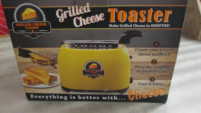 lot 24 image: Grilled Cheese Toaster open box, un...