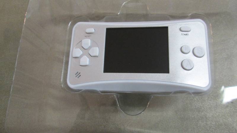 lot 102 image: Handheld Game Retail $49.99...