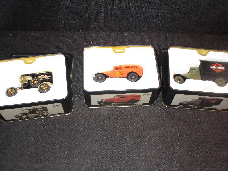 lot 15 image: Set of 3 Harley Davidson Dime Banks.. (32Ford Panel, 1913 Ford Model T Van, 30Chevy Delivery Truck)