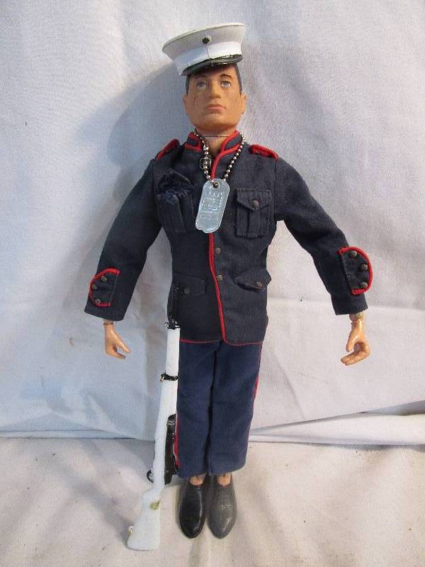 lot 155 image: Matel 1964 G.I Joe Dolly wG.I. Joe Dog Tag, Vintage Dress Blue Jacket Made In Hong Kong (missing belt & 1 botton)