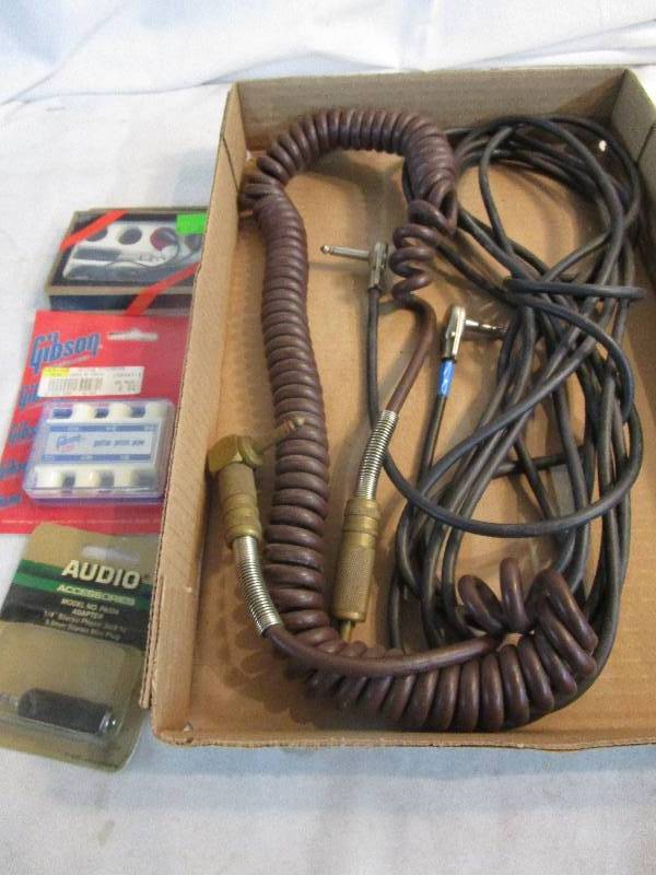 lot 198 image: Guitar Cords and Gibson guitar pitch pipe