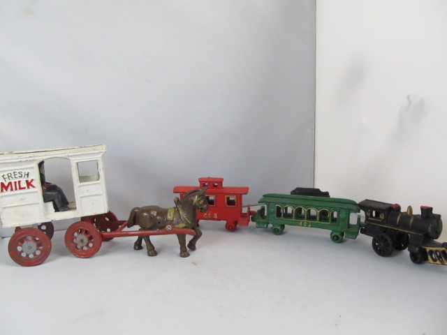 lot 26 image: Cast Iron Toy Milk Wagon & Train