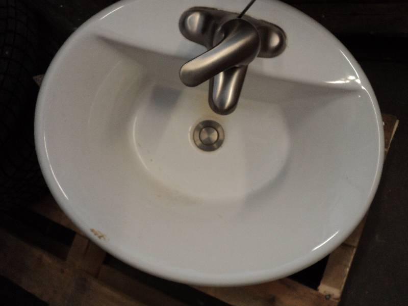 oval sink with faucets...
