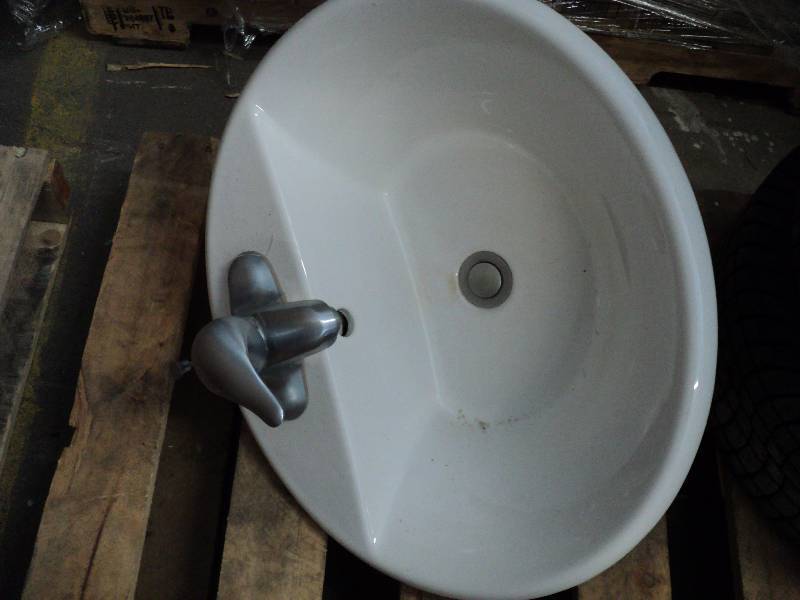 oval sink with faucets...
