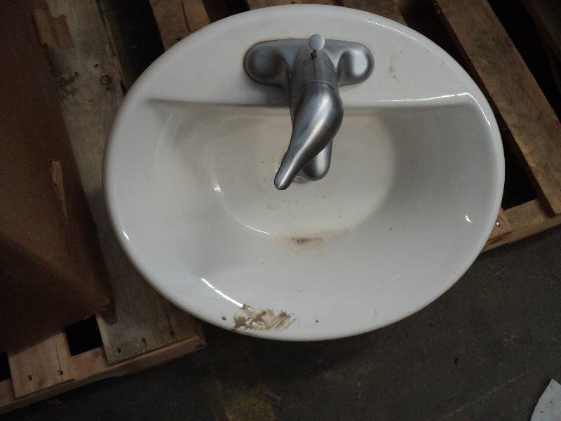 oval sink with faucets...