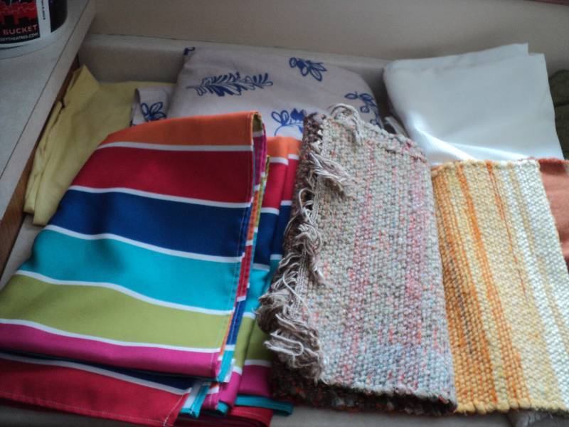 assortment of table cloths, runners...