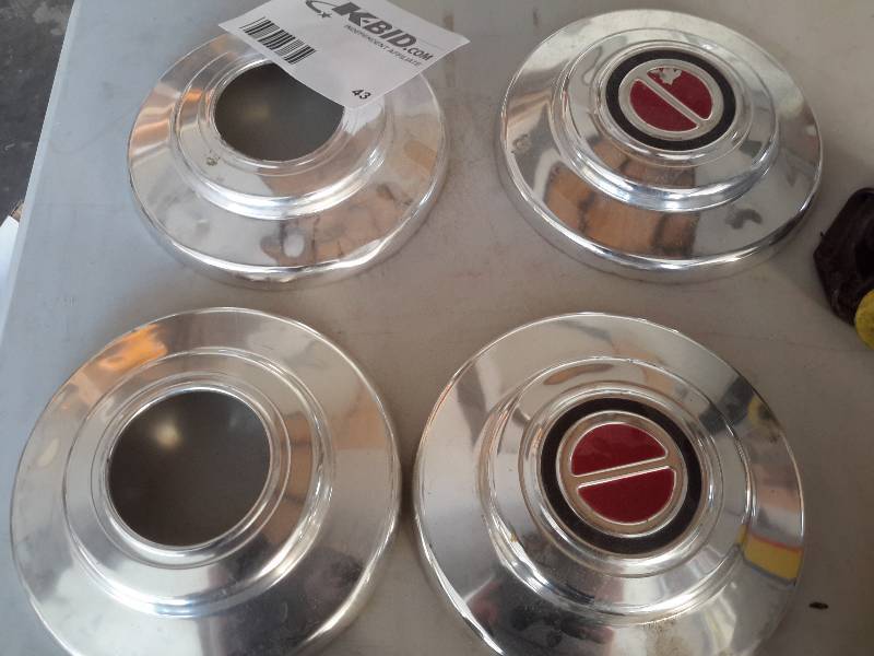 4 vintage hub caps, Vintage irons, screw jack, paper punch, door latch, Distributor cap