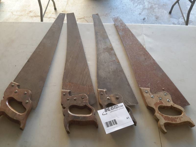 4 vintage hand saws as pictured