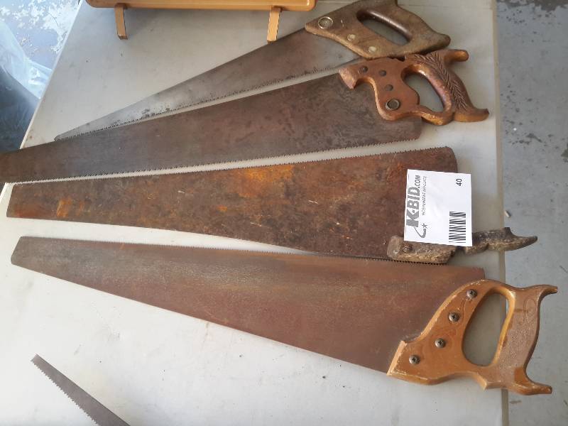 4 vintage hand saws as pictured