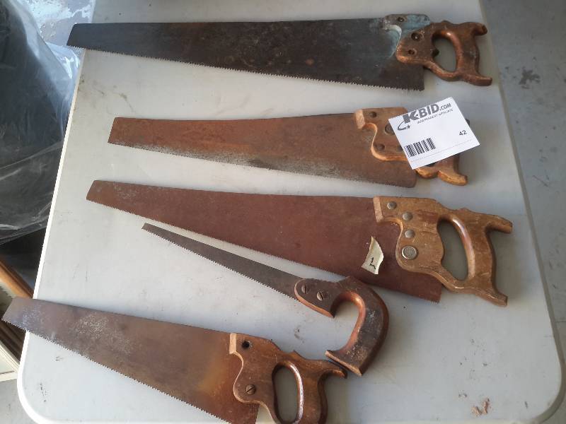 5 vintage hand saws as pictured