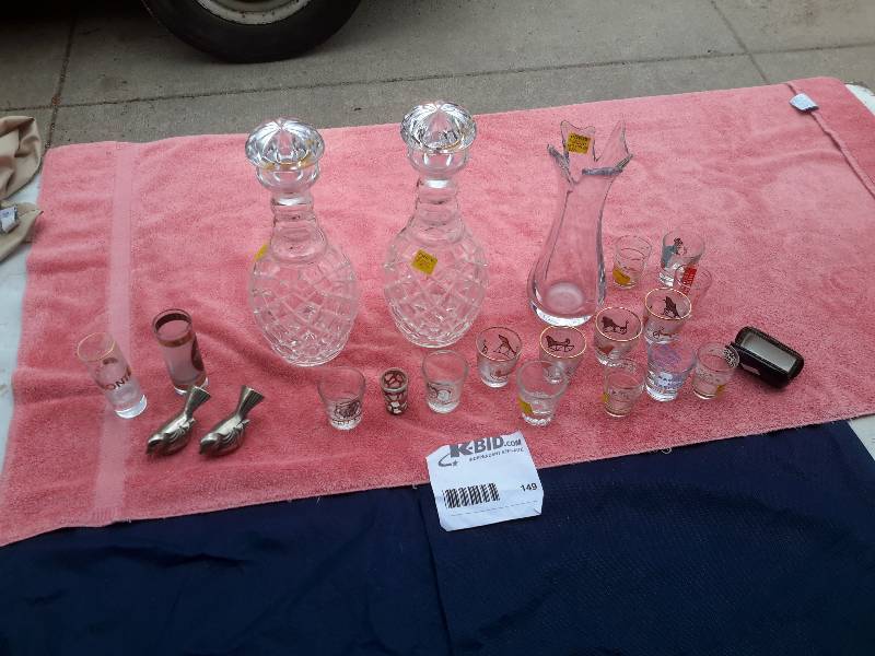 Lot of cut glass pitchers with covers.. Vase and large lot of shot glasses