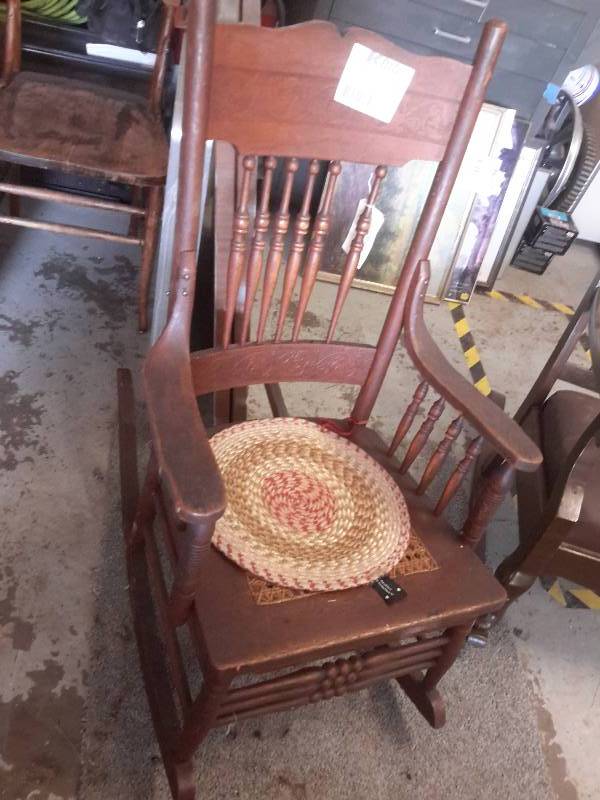 2 nice solid rockers.. One has a wicker seat that needs replacing
