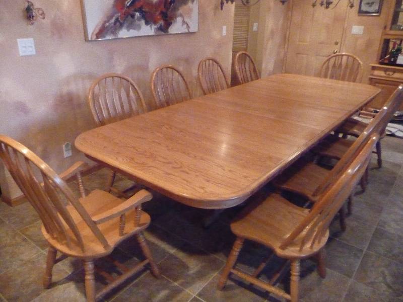 lot 702 image: OAK DINING TABLE AND 10 CHAIRS