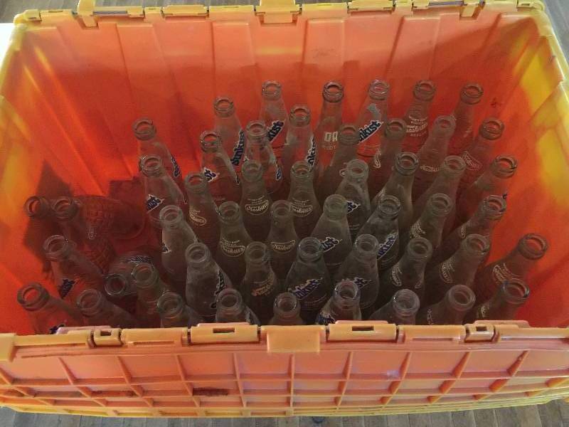 lot 112 image: Tote of Old Soda Bottles