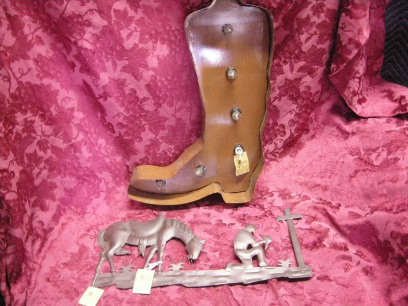 lot 38 image: Praying Cowboy and Light-up Boot