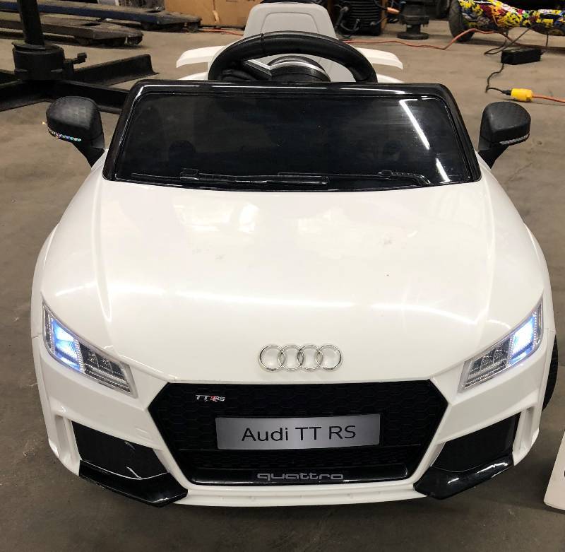 lot 3 image: White Audi TT RS Power Wheels Ride-On Toy with Battery & Charger