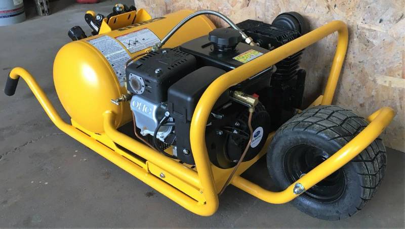 lot 1 image: NEW DEWALT 10 GALLON 9.9 CFM SUBARU POWERED CHOPPER WHEELBARROW COMPRESSOR