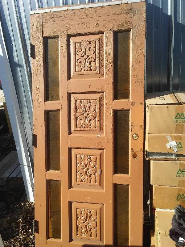 lot 32 image: Carved Door with side lights, 36 x 79  inches