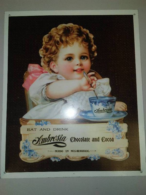 lot 53 image: Ambrosia Chocolate and Coco Metal Sign,