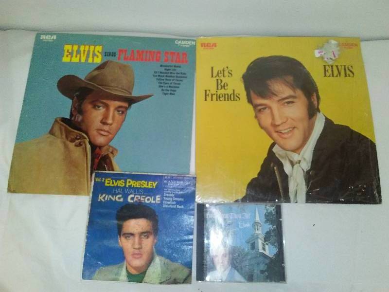 lot 142 image: ELVIS  2 12 in. albums, 45, and CD
