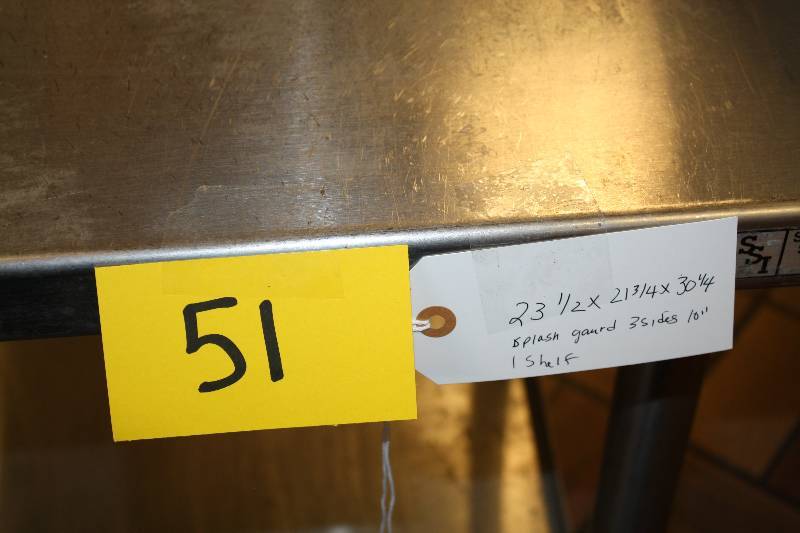 lot 51 image: Stainless steel worktable, NSF, stainless steel under shelf, caster mounted, 24x22x30.5H w10 3 side splash guard