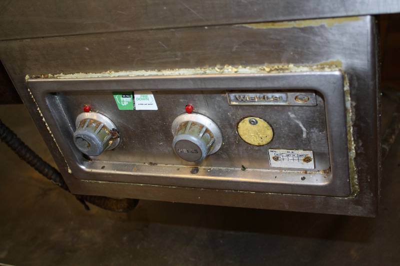 lot 55 image: SS Table with Back Splash, Undershelf and Wells 2 Compartment Drop In Food Warmer, 208240V, 72x30