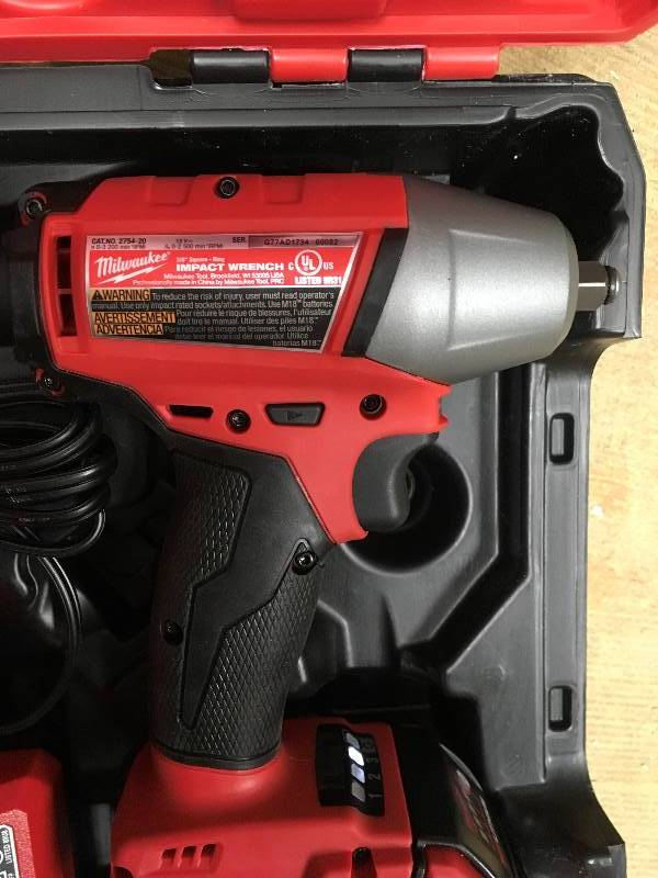 Milwaukee M18 FUEL 18-Volt Lithium-Ion Brushless Cordless 38 in. Impact Wrench WFriction Ring Kit With 1 battery used in like new condition