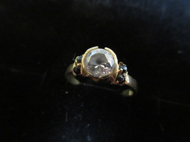 lot 322 image: 14K YELLOW GOLD BEZEL SET CZ RING