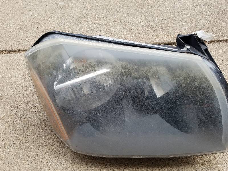 STEERING COLUMN AND HEADLIGHT