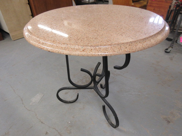 lot 423 image: ROUND STONE AND IRON TABLE