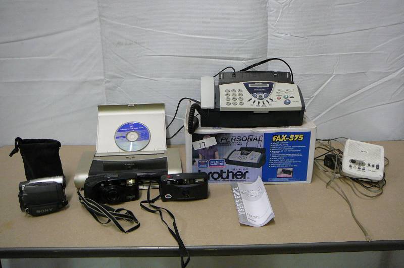 lot 17 image: Brothers Fax 575 Personal plain paper fax with user guide, Canon I80,copy machine, AT & T answering machine, 2 Freedom cameras, 1 Sony handy cam 20 x optical zoom