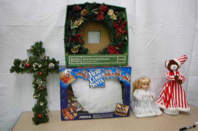 lot 19 image: 1- Animated singing 13 Angel, 1 animated singing 19 Christmas bear, Here comes Santa, lighted and musical activity set NEW in box, 1 - 20 decorated wreath NEW in box, 1 - 25 decorative cross