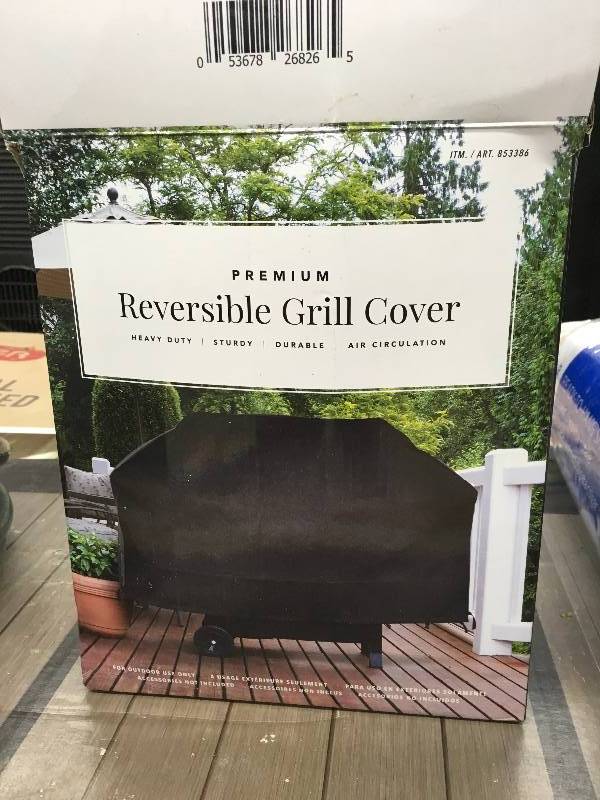 lot 570 image: REVERSIBLE GRILL COVER, RETAIL $29.99