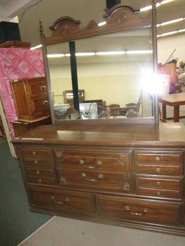 lot 23 image: Dresser with a Mirror. 8 drawers, 60L X 19W X 32 12 H