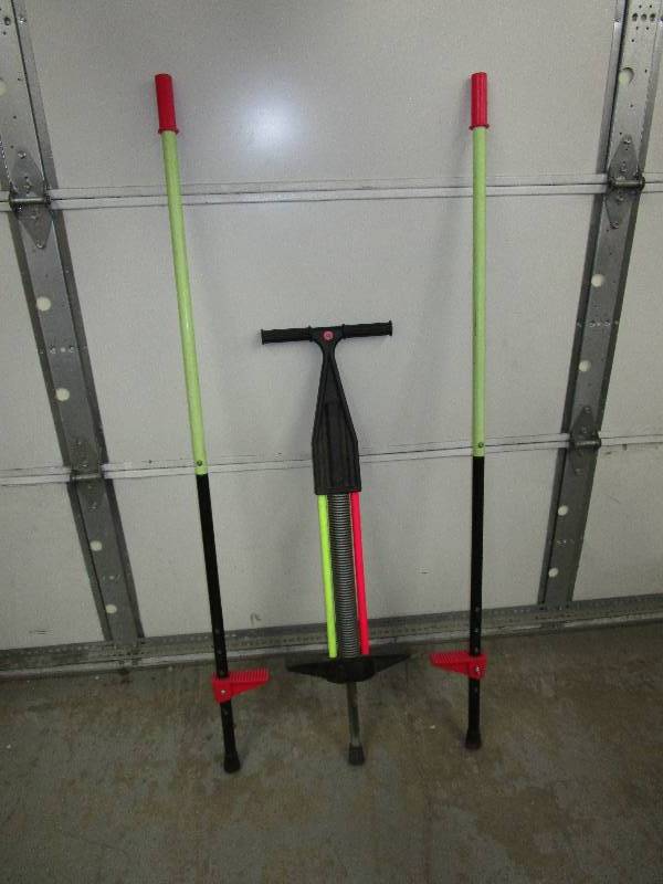 lot 128 image: pogo stick and stilits