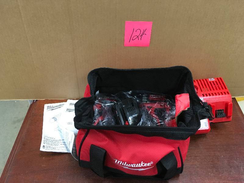 Milwaukee M18 18 Volt Lithium-Ion Brushless Cordless Hammer DrillImpact Combo Kit open box not used