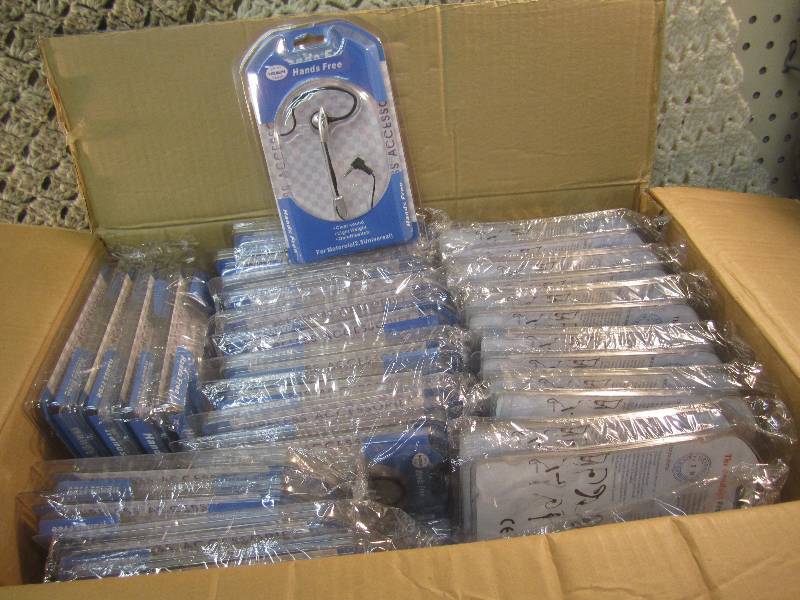 lot 169 image: Case of 100 Universal Handsfree Ear...