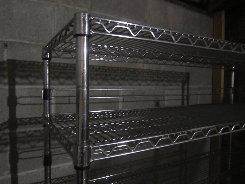 lot 400 image: Metal NSF grade shelf on wheels, nice and sturdy.  4 wide 6 tall
