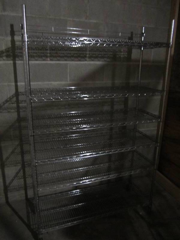 lot 401 image: Metal NSF grade shelf on wheels, nice and sturdy.  4 wide 6 tall