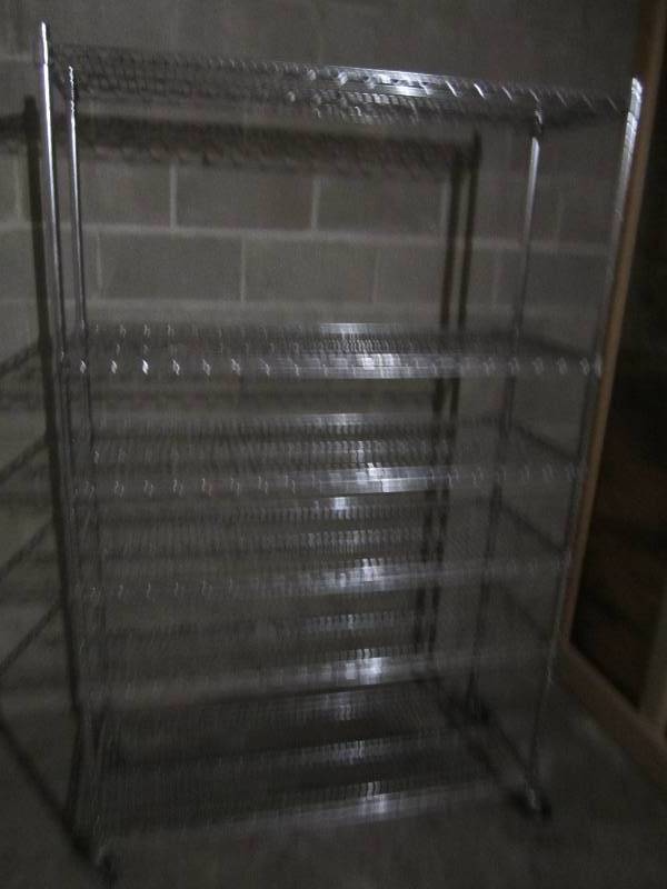 lot 402 image: Metal NSF grade shelf on wheels, nice and sturdy.  4 wide 6 tall
