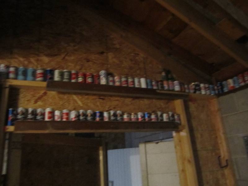 lot 404 image: Approximately 155 Vintage beer cans and collector pop bottles.