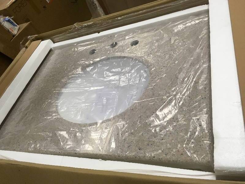 lot 34 image: Home Decorators Collection Newport 37 in. W x 21-12 in. D Bath Vanity in Ivory with Granite Vanity Top in Champagne Open Box not used