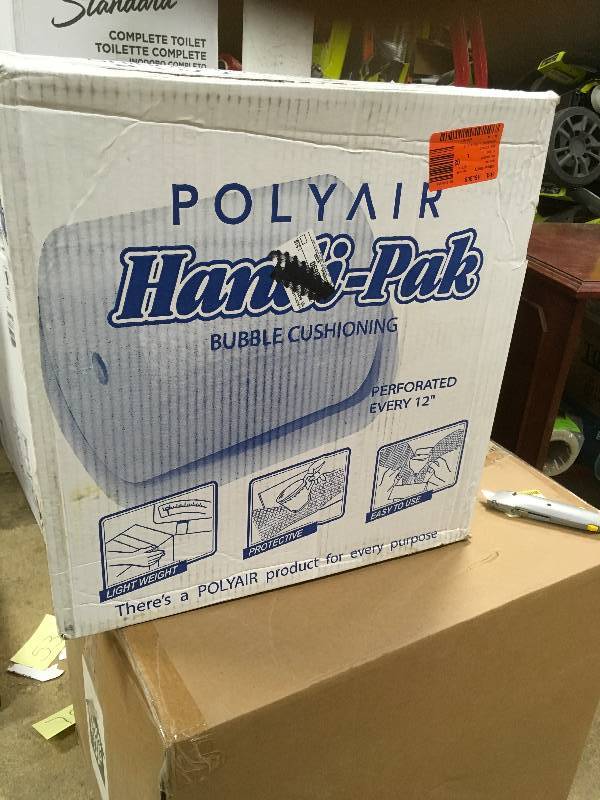 lot 58 image: Polyair 316 in. x 12 in. x 100 ft. Perforated Bubble Cushion Dispensor Box Open Box not used