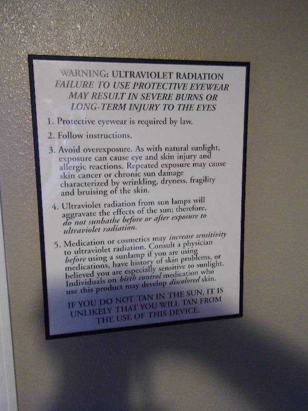 lot 28 image: Lot of 8 UV Tanning Warning Signs