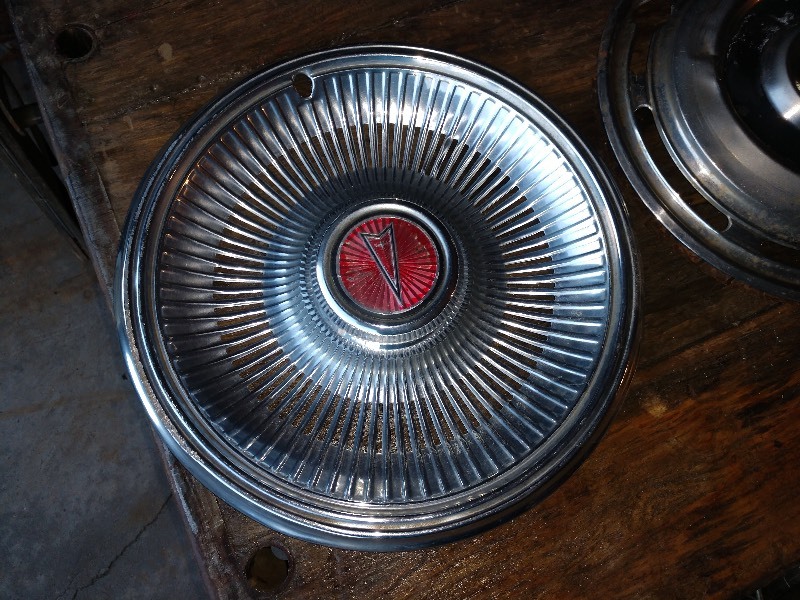 lot 16 image: Hub Caps (2)- Pontiac and Unknown