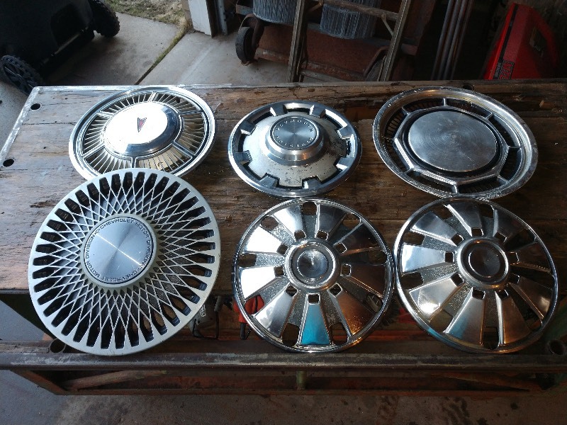 lot 19 image: Hub Caps (6)- Pontiac, Plymouth Division, Chevrolet, and Unknowns